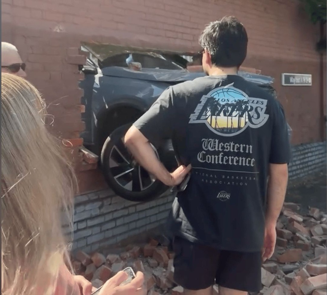 Passengers left stunned after car smashes through wall at Streatham station: Footage shows passengers at Streatham station trying to make sense of the chaos