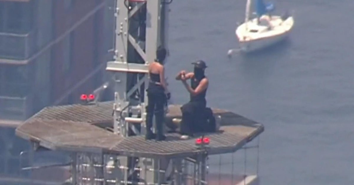 Empire State Building climbers engaged and under arrest: Two people in black masks scaled the Empire State Building, scrambling the New York City Police Department. They call themselves "roof-toppers," or stunt climbers, and they unfurled a banner about world peace before one of them got out a ring and proposed. By the time they got down, they were engaged and under arrest. Tom Hanson reports. #EmpireStateBuilding #RoofToppers #StuntClimbing #WorldPeace #Engagement 1 4418cfc84c43cab8506a4f605bb5301d4132abbd