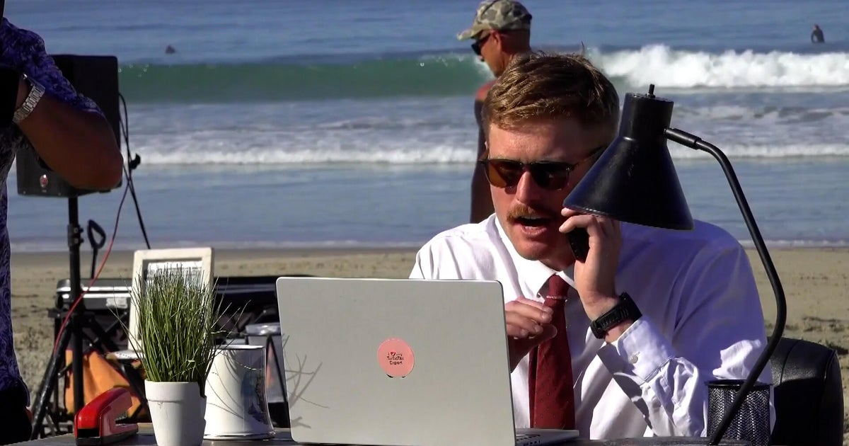 Man embraces remote work by setting up offices at the beach, baseball game: A California man is taking advantage of remote work with viral office settings that are attracting fans, critics, and thousands of views. Gwen Baumgarder joined him for a workday at the ballpark. #RemoteWork #WorkFromAnywhere #DigitalNomad #BeachOffice #WorkLifeBalance 1 a121972895d3ec5c62d7123c9a6a4697356d1ee9