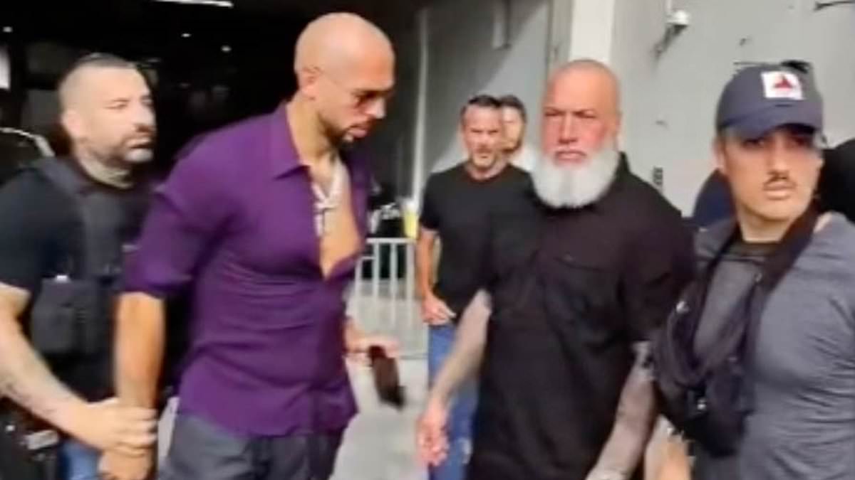 Brazen Andrew Tate appears to try and slip phone to bodyguard as he is arrested over child porn charge: Newly released video shows controversial influencers Andrew and Tristan Tate being handcuffed and arrested in Miami on Saturday. #AndrewTate #TristanTate #MiamiArrest #ControversialInfluencers #ChildPornCharge 1 c45a327bebadbde47a6b43e0043dd5466039edc5
