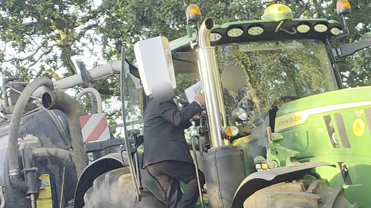 Moment suit-wearing motorist 'attacks' tractor driver in 'road rage row over who should reverse' on narrow country lane 1 1134ed189ca9b695f5d12ad3e0784b372af0883ab645178349a0d0b8dd08dca9