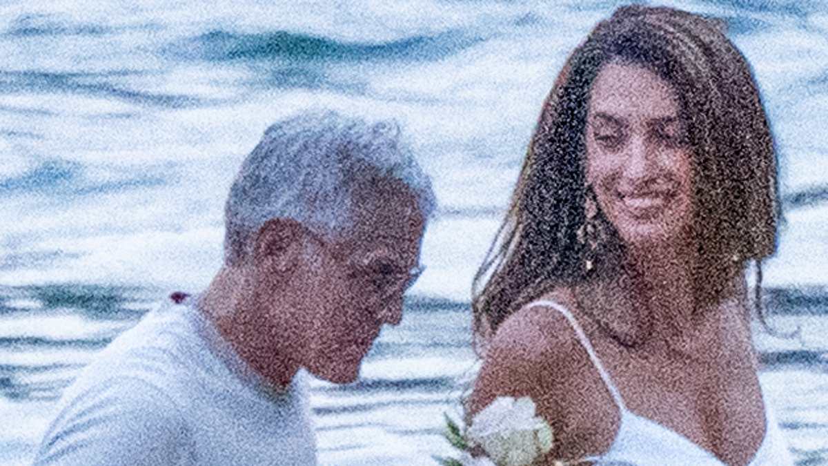 George Clooney's wife Amal wows in slinky white dress on romantic Lake Como date night... after evacuating their home in France 1 6d125e06914f334630357a7b02fe2b1f9b5920378ede7f9cde67863be1cfb39c
