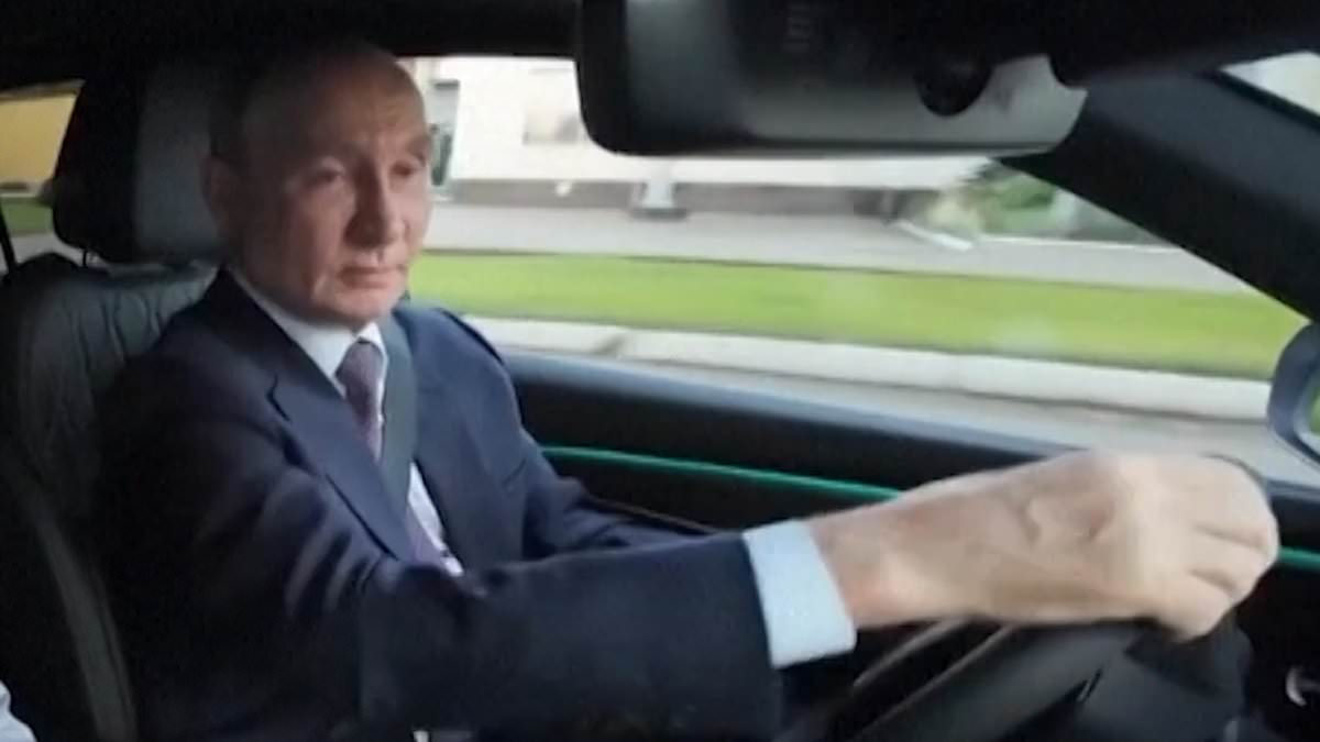 Vladimir Putin shows off his driving skills as he gets behind the wheel to test new Russian motor 1 c1be3276a6e2780da53de2131d991247b965235032efa5b81f1f67effb9b7ec6