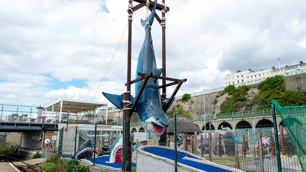 They're gonna need a bigger bunker! Row erupts over giant fake shark erected on crazy golf course without planning permission 1 1af8cd7e14b2f7af045f7b5114aa52cd2fa1ffdd3e917b8d88a5dd0763c96dc3