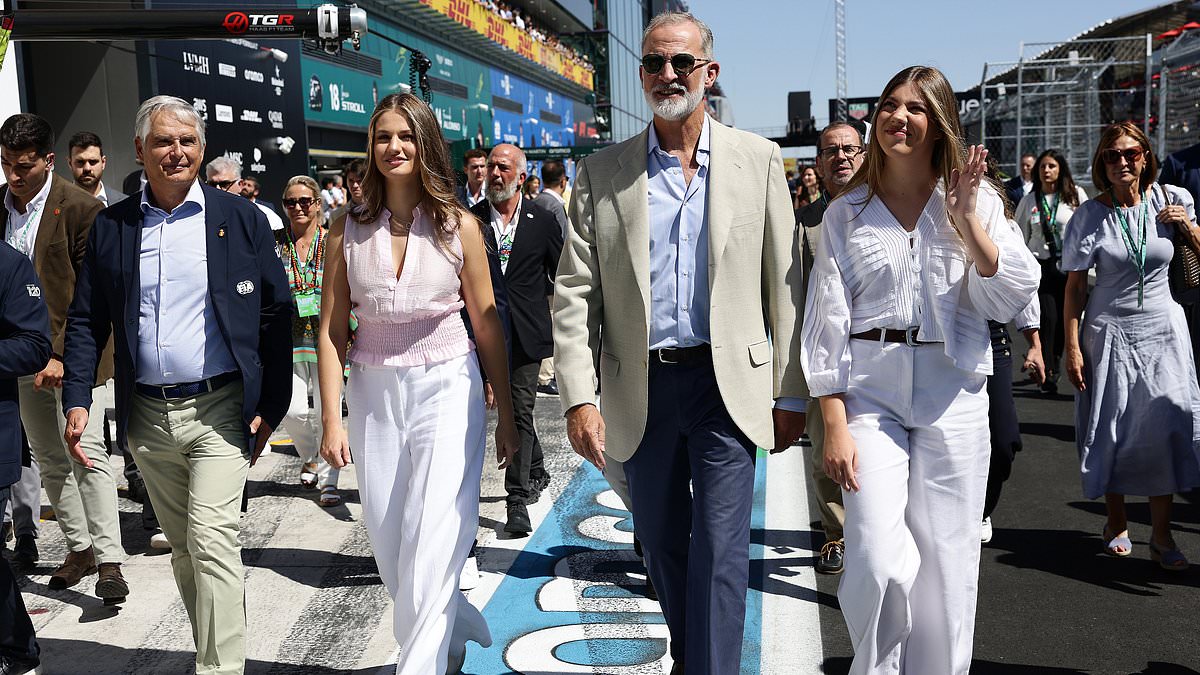 Queen Letizia's lookalike daughters Princess Leonor, 20, and Infanta Sofía, 19, look chic in matching white trousers and stylish blouses as they join King Felipe at Spanish Grand Prix 1 734ea40370a7b92e419604dc78c0486082f8bb316aa44fddb9077be402370d6d